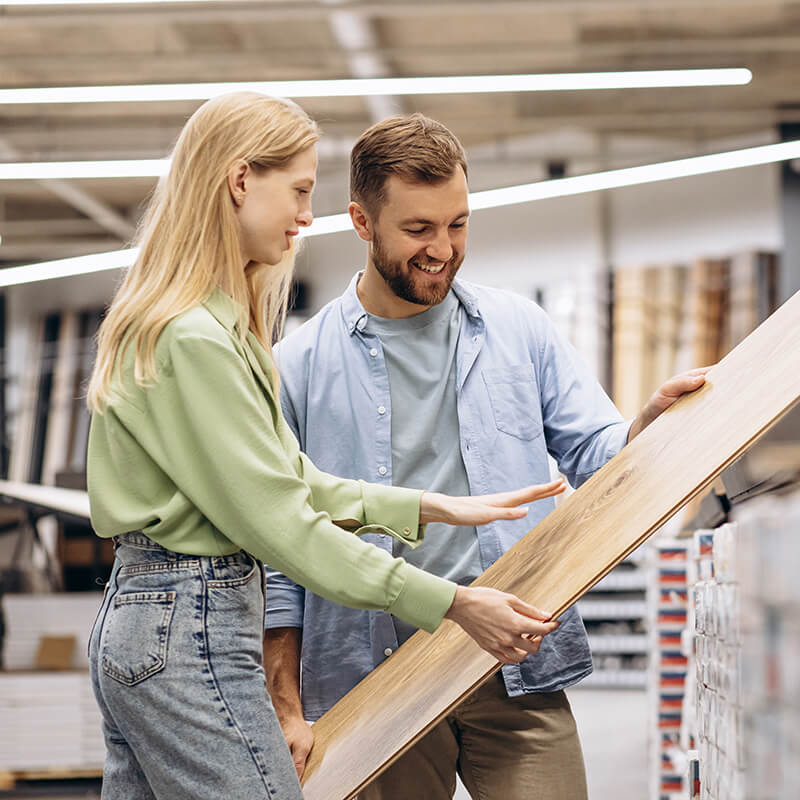 Homeowners browsing laminate flooring