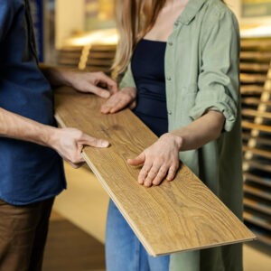 Customers observing laminate flooring surface texture