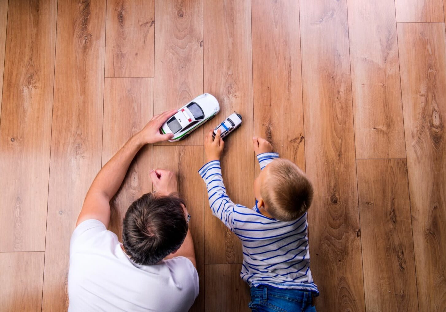 Father and son playing toy car | Carpet To Go